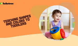 A happy toddler plays with a colorful shape sorter, learning shapes and colors.