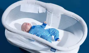 A baby doll sleeps soundly in a Halo bassinet, a safe and stylish alternative to traditional cribs.