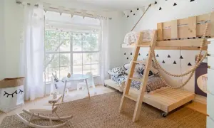 Charming toddler bedroom ideas: a wooden bunk bed, a play table, and a rocking horse create a whimsical space.