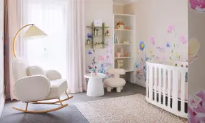 Dreamy white nursery ideas with floral wall decals, a cozy rocking chair, and a sweet crib.