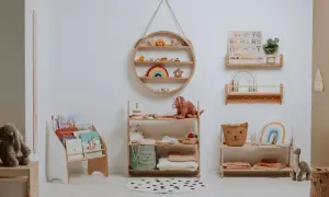 A serene nursery showcasing Montessori organization at home. Wooden shelves display books, toys, and soft blankets, creating a calm and inviting space for a child.