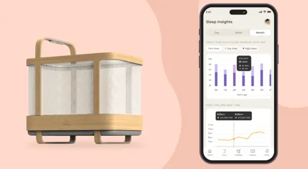 A modern 4 in 1 crib with a phone displaying sleep insights, showing a baby's sleep patterns over time.
