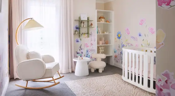 Dreamy white nursery ideas with floral wall decals, a cozy rocking chair, and a sweet crib.