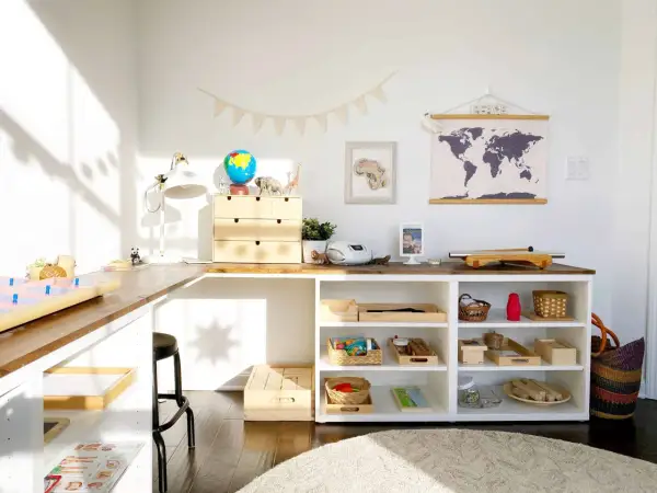 Inspiring Montessori shelf ideas for a child's learning space, featuring a globe, animal figures, and organized trays of educational materials.