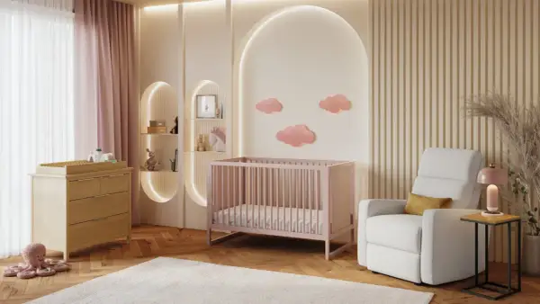 A serene nursery with pink crib, changing table, and cloud decor. This sweet setup is perfect for baby girl nursery themes.